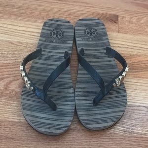 Tory Burch flip flops with gold charms